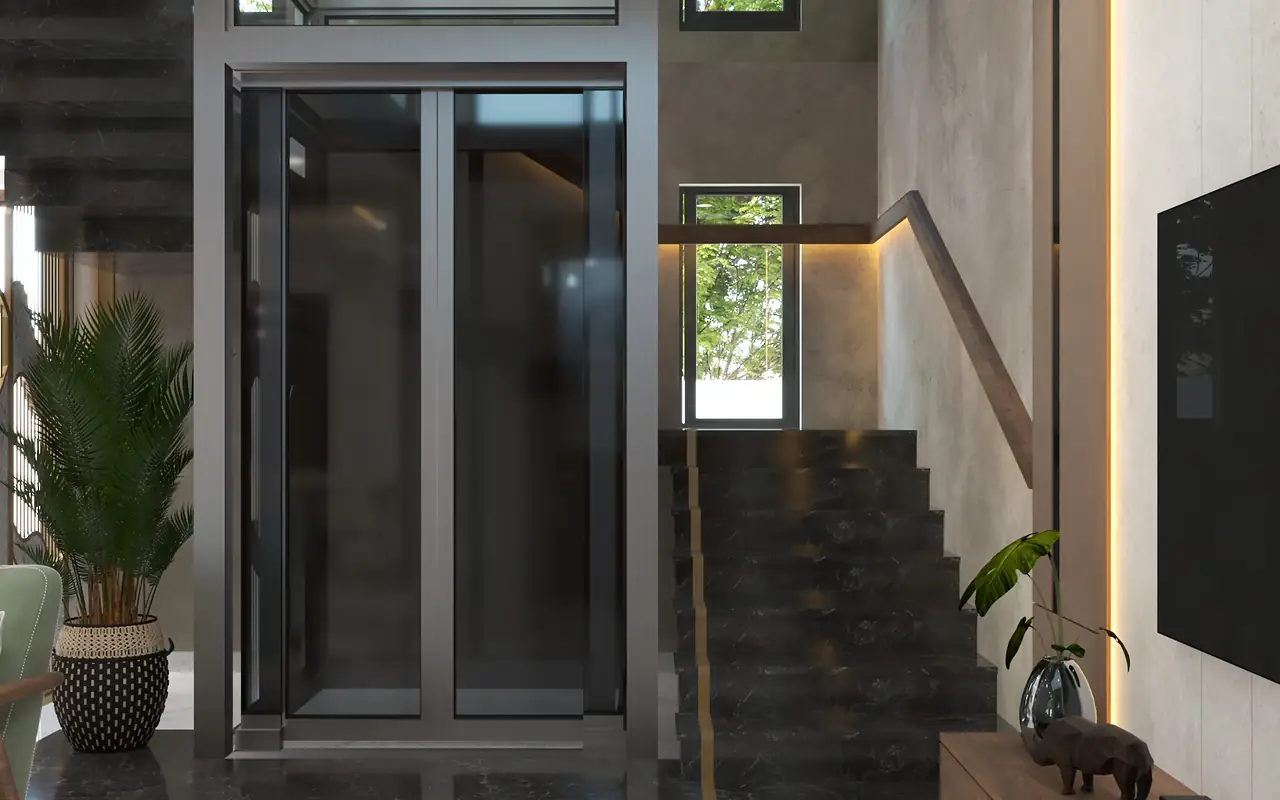 A glass lift shaft beside a dark stone stair in a double-height hall.