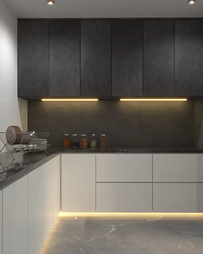 A matte graphite kitchen run with a stone counter and linear under-cabinet light.